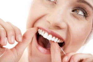 woman-flossing-close-up-oral-health